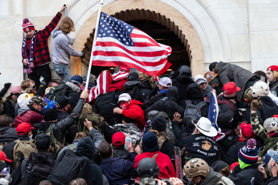 Rioters clash with police trying to enter Capitol building through the front doors.