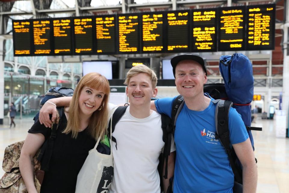 From left: Becky Moriarty, Jared Hill and Rory Leighton at Paddington Station in London, on their way to Glastonbury (Ashlee Ruggels/PA) (PA Wire)