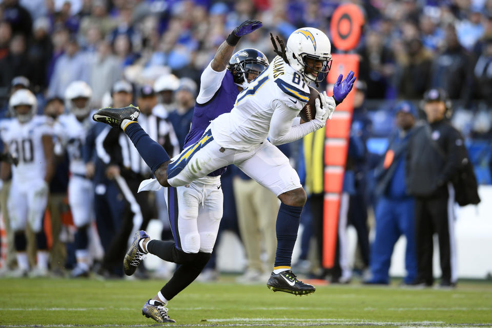 <p>Los Angeles Chargers wide receiver Mike Williams (81) makes a catch for a first down in front of Baltimore Ravens cornerback Jimmy Smith in the second half of an NFL wild card playoff football game, Sunday, Jan. 6, 2019, in Baltimore. (AP Photo/Nick Wass) </p>