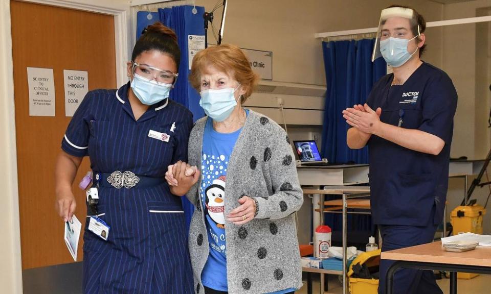 Margaret Keenan with the Filipina nurse May Parsons after becoming the first person in the UK to receive the Pfizer/BioNTech vaccine.