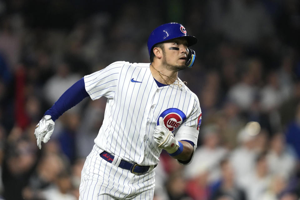 Chicago Cubs' Seiya Suzuki watches his two-run double off Pittsburgh Pirates relief pitcher Colin Holderman during the eighth inning of a baseball game Wednesday, June 14, 2023, in Chicago. (AP Photo/Charles Rex Arbogast)