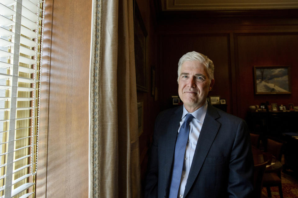 Supreme Court Justice Neil Gorsuch poses for a portrait in his office at the Supreme Court, Monday, July 29, 2024, in Washington. Gorsuch is out with a new book in which he says ordinary Americans are "getting whacked" by too many laws and regulations. "Over Ruled: The Human Toll of Too Much Law" is being published on Tuesday, Aug. 6. (AP Photo/Rod Lamkey, Jr.)