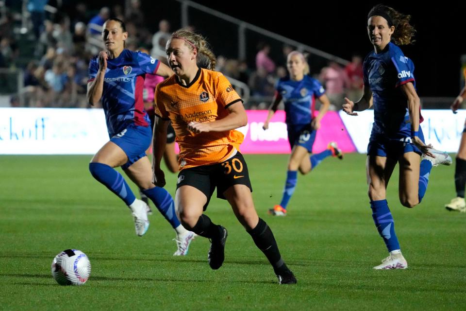 Houston Dash midfielder Avery Patterson dribbles the ball against the North Carolina Courage in her NWSL debut.