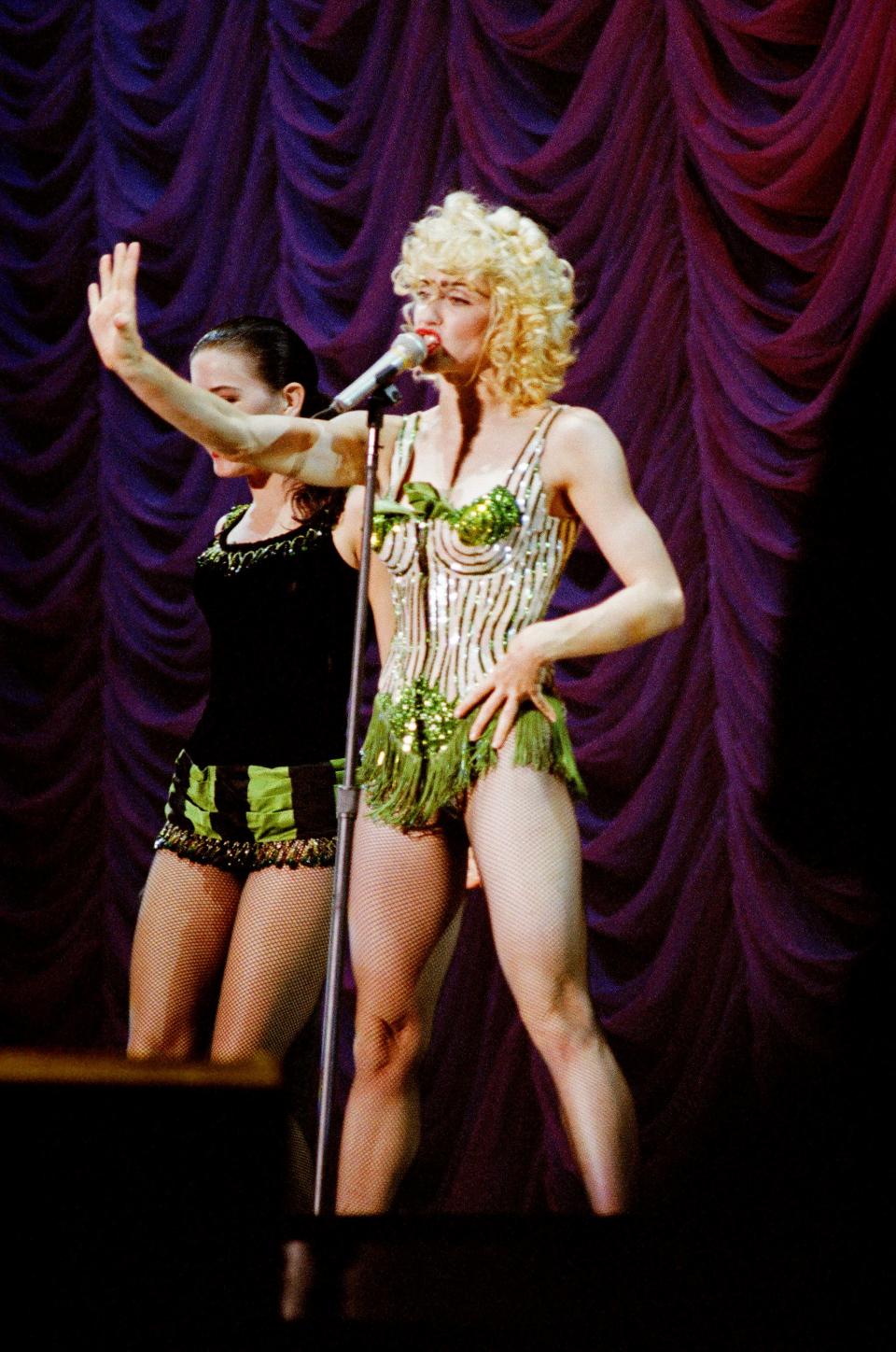 Madonna performing on stage at Wembley Stadium 1990 during her Blonde Ambition tour.