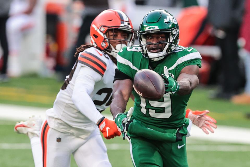 New York Jets receiver Breshad Perriman reaches for the ball as Cleveland Browns safety Sheldrick Redwine defends Dec. 27, 2020 in East Rutherford, N.J.