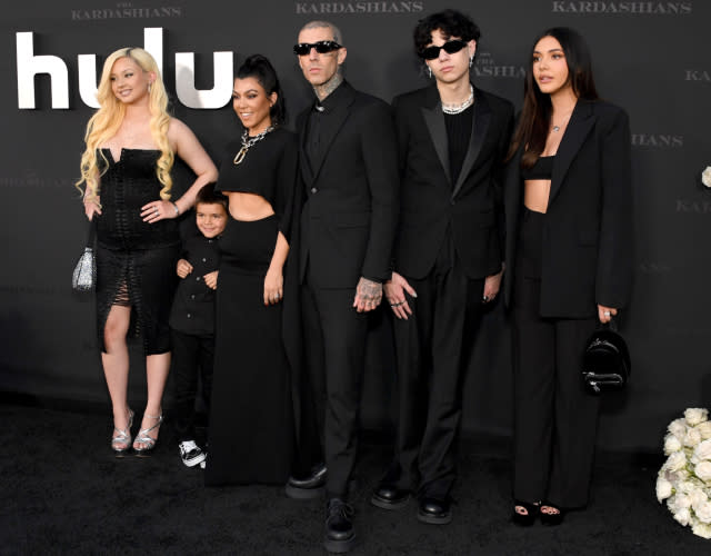 LOS ANGELES, CALIFORNIA – APRIL 07: (L-R) Alabama Barker, Reign Disick, Kourtney Kardashian, Travis Barker, Landon Barker and Atiana De La Hoya attend the Los Angeles premiere of Hulu’s new show “The Kardashians” at Goya Studios on April 07, 2022 in Los Angeles, California.<em> Photo by Jon Kopaloff/FilmMagic for ABA.</em>