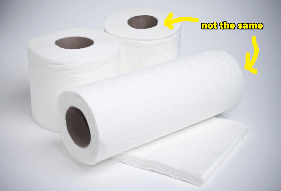Three rolls of paper towels, one partially unrolled, on a plain background