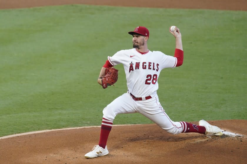 Los Angeles Angels starting pitcher Andrew Heaney throws during the first inning of a baseball game.