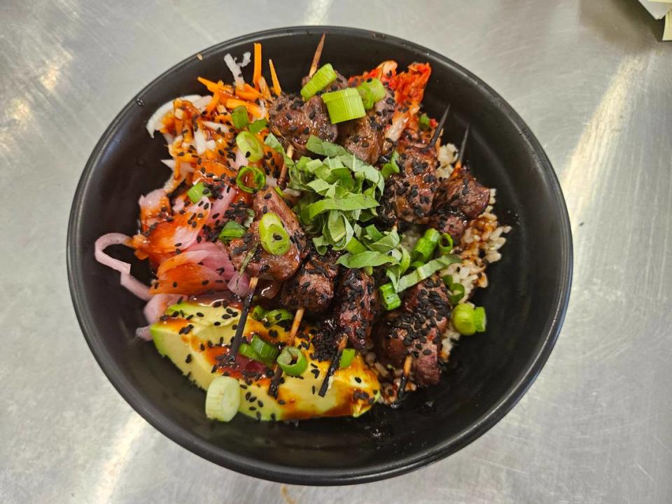 The beef bulgogi bowl at Chowa Bowl in Morro Bay is topped with skewers of grilled filet mignon chunks marinated in a sweet-salty-savory glaze. Other proteins, such as chicken or shrimp, can be substituted for the beef.