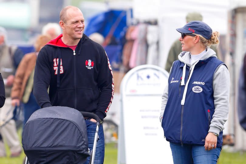 Mike Tindall pushes daughter Mia Tindall in her pushchair as he and Zara Phillips attend the SYMM International Horse Trial. Mike is seen here wearing a Gloucester Rugby hoodie.