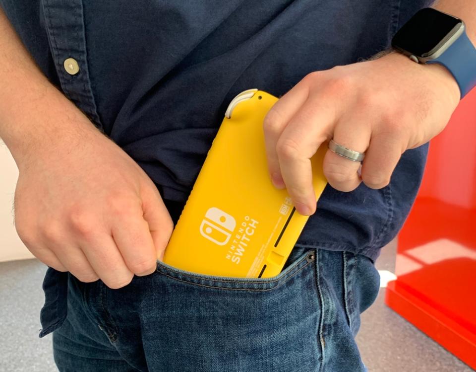 The Nintendo Switch Lite easily slides into my jeans pocket. (Image: Howley)