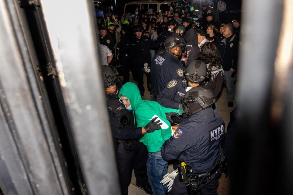 Violent protests at Columbia led NYPD cops in riot gear to storm campus and cuff more than 100 people last week. Getty Images