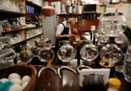 Shizuo Mori, the owner of Heckeln coffee shop makes sandwiches for customers at his shop in Tokyo