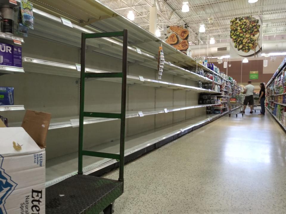 Empty shelves awaited customers seeking bottled water on Saturday afternoon at the Publix Super Market at Crown Centre in Orange City as preparations continued for Tropical Storm Ian.