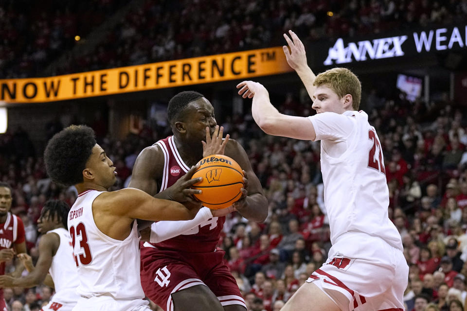 Wisconsin's Chucky Hepburn (23) tries to take the ball from Indiana's Payton Sparks during the first half of an NCAA college basketball game Friday, Jan. 19, 2024, in Madison, Wis. (AP Photo/Andy Manis)