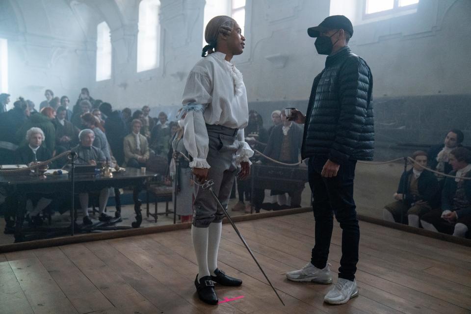 Kelvin Harrison Jr., left, and director Stephen Williams on the set of "Chevalier."