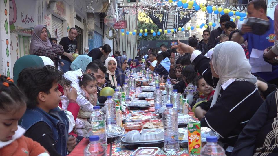 People crowd around Egypt's longest Iftar table before breaking their daily fast on the 15th day of the Muslim holy month of Ramadan, in Cairo's Matareya neighborhood, March 25, 2024. / Credit: CBS News/Ahmed Shawkat