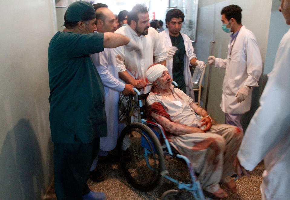 <p>Relatives assist a wounded man in a hospital after a suicide attack on a mosque in Herat, Afghanistan, Tuesday, Aug. 1, 2017. (Photo: Hamed Sarfarazi/AP) </p>
