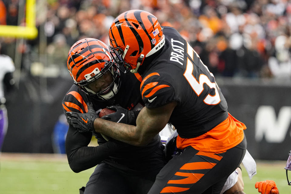 Cincinnati Bengals safety Vonn Bell (24) celebrates with linebacker Germaine Pratt (57) after recovering a fumble against the Baltimore Ravens in the second half of an NFL football game in Cincinnati, Sunday, Jan. 8, 2023. (AP Photo/Joshua A. Bickel)
