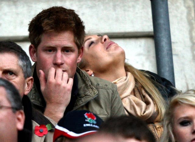 Harry, left, and Chelsy Davy at a rugby match