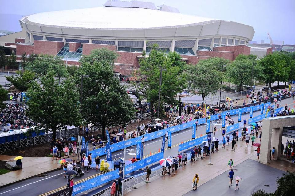 Participants in the Ironman 70.3 Pennsylvania Happy Valley run the chute leading to the finish line inside Beaver Stadium on Sunday, July 2, 2023. Steve Manuel/For the CDT