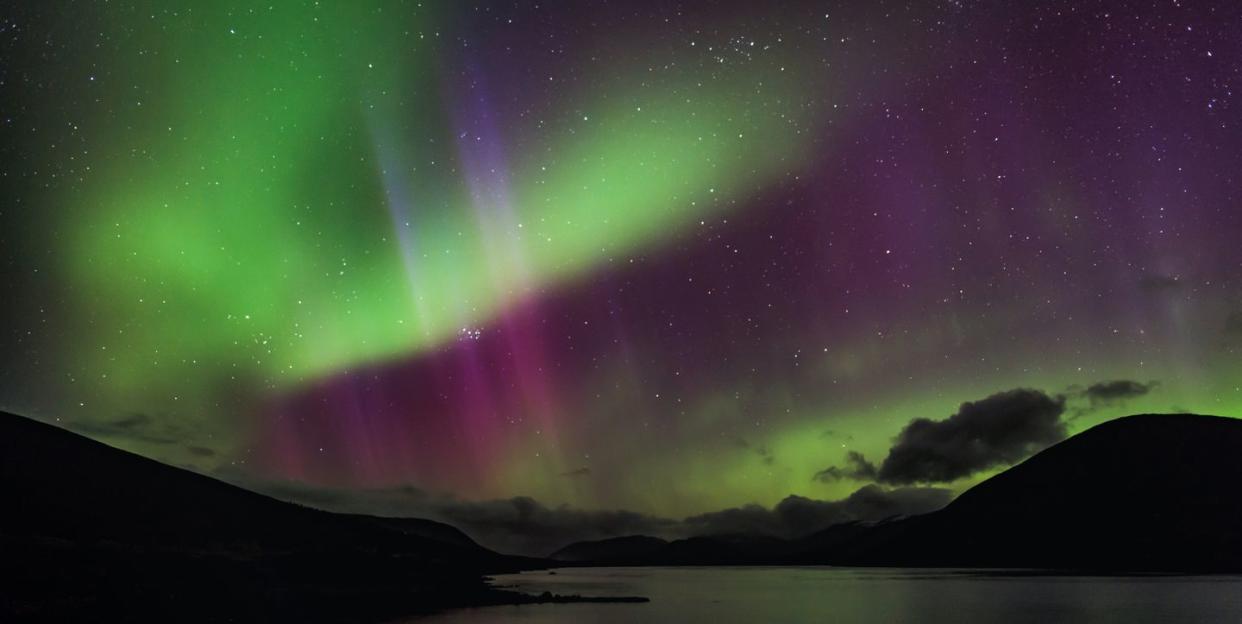aurora borealis over loch glascarnoch, by garve, in the highlands of scotland