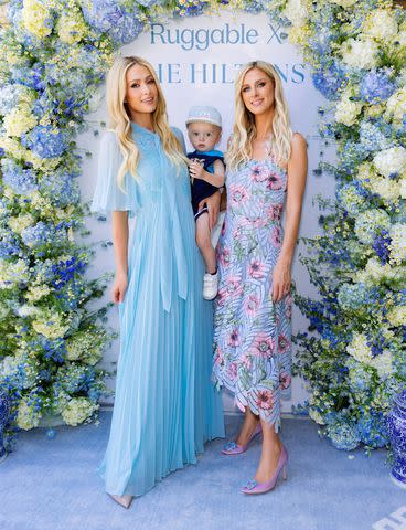 <p>Kevin Ostajewski</p> Paris and her son Phoenix with Nicky Hilton