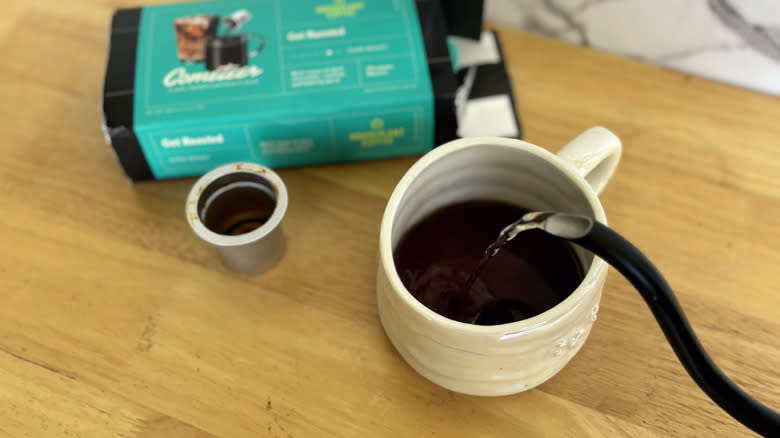 pouring water into mug