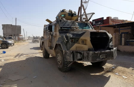 A military vehicle of eastern Libyan forces is seen in Ain Zara, south of Tripoli, Libya April 11, 2019. Picture taken April 11, 2019. REUTERS/Stringer