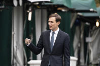 White House senior adviser Jared Kushner greets a friend after a television interview at the White House, Monday, Oct. 26, 2020, in Washington. (AP Photo/Alex Brandon)