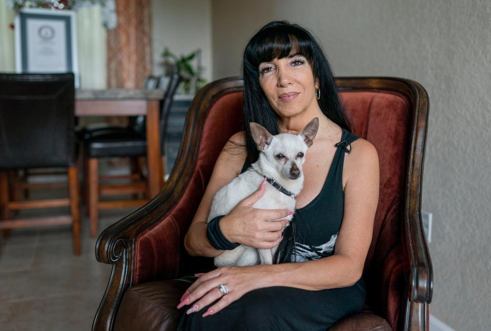 Gisela Shore with her chihuahua TobyKeith that Guiness confirmed that he is the world's oldest living dog at more than 21 years old, in Greenacres, Florida on April 30, 2022.