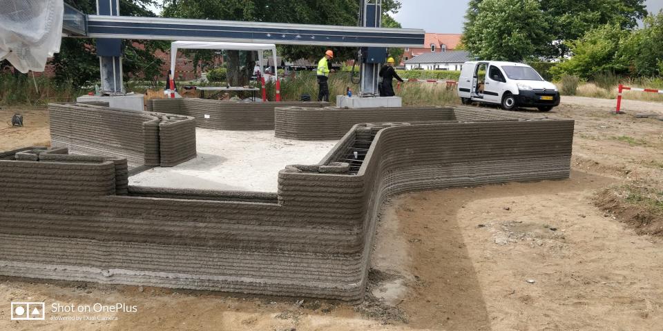 A 3D printer as it prints the walls of a tiny home.