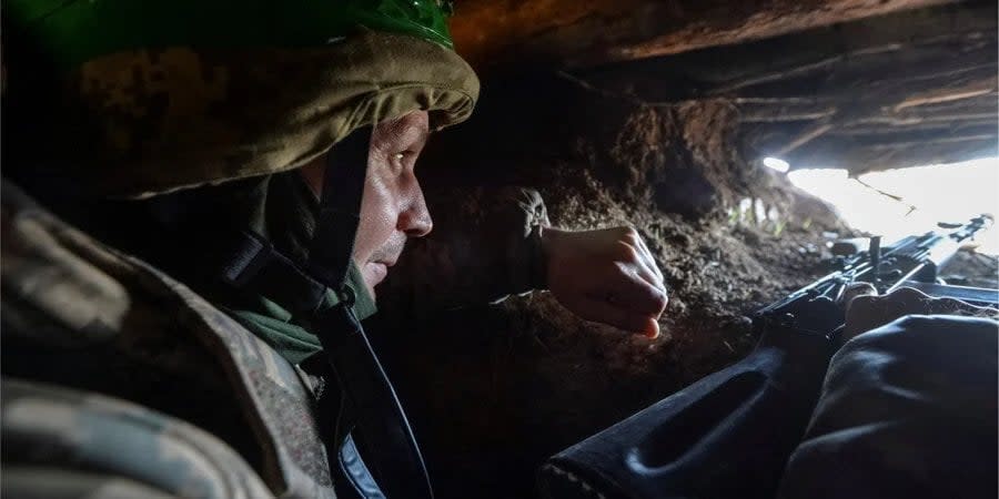 A Ukrainian soldier in a combat position in the Bakhmut area