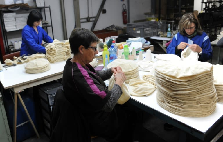 Employees work on berets at Laulhere factory in Oloron Sainte-Marie, in the French Basque region of southwestern France on May 19, 2016