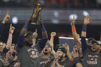 Houston Astros designated hitter Yordan Alvarez holds the trophy after their win against the Boston Red Sox in Game 6 of baseball's American League Championship Series Friday, Oct. 22, 2021, in Houston. The Astros won 5-0, to win the ALCS series in game six. (AP Photo/Tony Gutierrez)