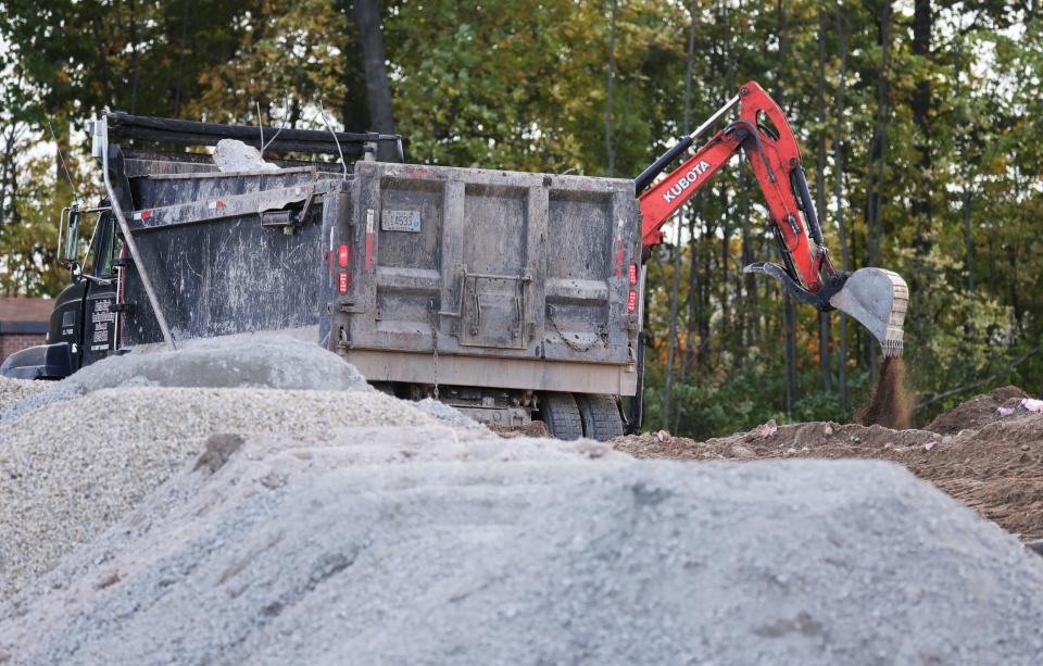 Crews work on transforming the lot where the former Manitowoc Visitor Center was located as seen, Thursday, September 28, 2023, in Manitowoc, Wis. Crews are working on cleaning the lot up after the building’s demolition.