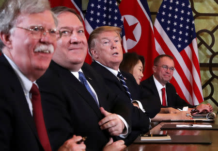 U.S. President Donald Trump, U.S. Secretary of State Mike Pompeo, White House national security adviser John Bolton and acting White House Chief of Staff Mick Mulvaney attend the extended bilateral meeting in the Metropole hotel with North Korea's leader Kim Jong Un and his delegation during the second North Korea-U.S. summit in Hanoi, Vietnam February 28, 2019. REUTERS/Leah Millis