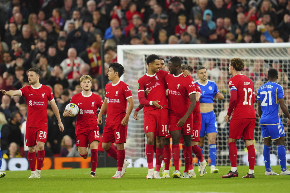 Liverpool's Cody Gakpo, center, celebrates after scoring his side's opening goal during the English League Cup third round soccer match between Liverpool and Leicester City at the Anfield stadium in Liverpool, England, Wednesday, Sept. 27, 2023. (AP Photo/Jon Super)