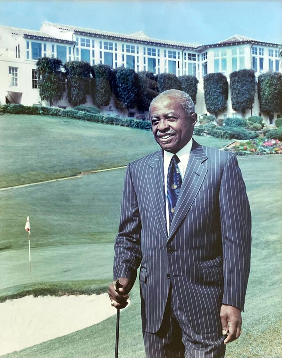 Roy standing in front of 18th green at Olympic club.