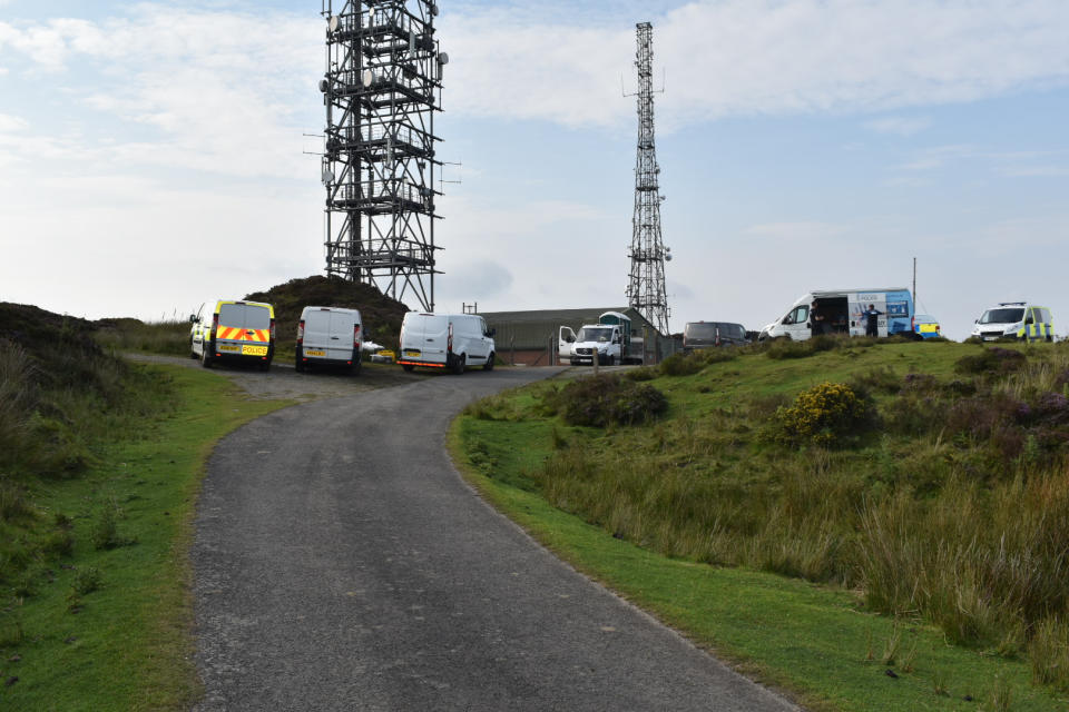 Police officers at the scene near the summit of Brown Clee Hill in south Shropshire. A murder investigation has been launched after a pensioner was found dead in the area.