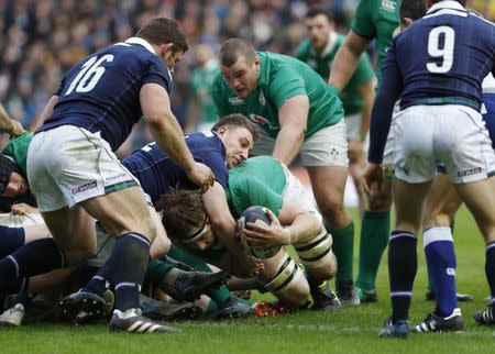 Britain Rugby Union - Scotland v Ireland - Six Nations Championship - BT Murrayfield Stadium, Edinburgh - 4/2/17 Iain Henderson of Ireland scores try despite tackle by Duncan Weir of Scotland Reuters / Russell Cheyne Livepic