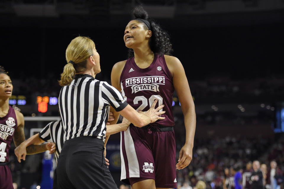 Mississippi State's Yemiyah Morris, right, is spoken to by an official after a scuffle under the basket during a championship match against South Carolina at the Southeastern Conference women's NCAA college basketball tournament in Greenville, S.C., Sunday, March 8, 2020. (AP Photo/Richard Shiro)