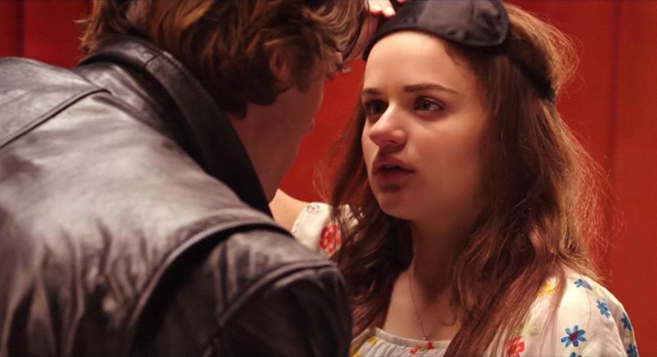 Joey King lifts a blindfold and looks surprised to see Jacob Elordi during a scene in "The Kissing Booth"