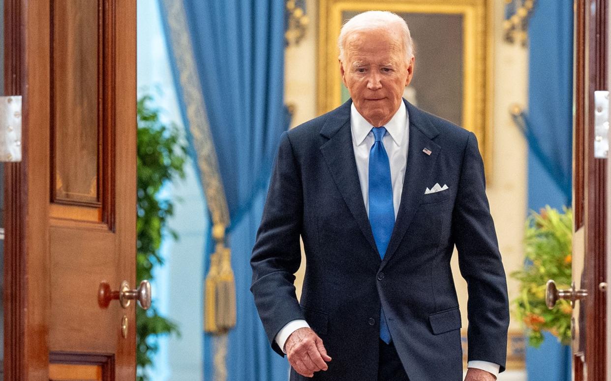 Joe Biden arrives for a news conference following the Supreme Court's ruling on charges against former President Donald Trump