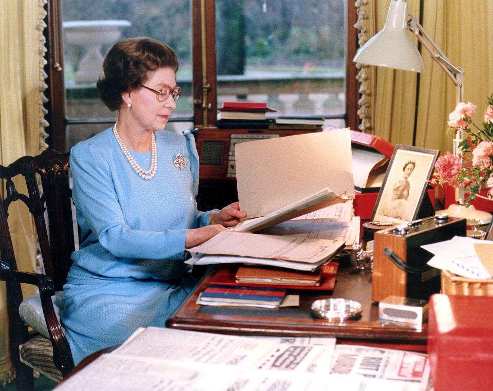 Queen Elizabeth at her desk in 1985