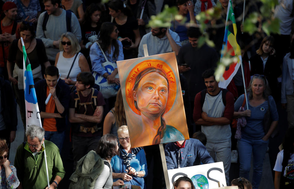 Protesters hold a placard depicting Swedish climate activist Greta Thunberg as they take part in the Fridays for Future climate change action protest in Paris, France, September 20, 2019. (Photo: Charles Platiau/Reuters)