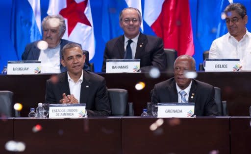 US President Barack Obama (L) and Grenada's Prime Minister Joseph Thomas attend the opening of the VI Americas Summit at the Julio Cesar Turbay Ayala Convention Center in Cartagena, Colombia, on April 14