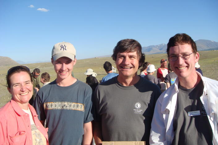 This 2008 photo supplied by Linda Bugbee shows, from left, Bugbee, her son Matt, astronomy professor Alex Filippenko and Linda’s husband George Bugbee in Mongolia, where they had traveled with a tour to watch a solar eclipse. The Bugbees are traveling to watch their fourth solar eclipse on Nov. 14 in Cairns, Australia, where some 50,000 tourists are expected to see the phenomenon. (AP Photo/courtesy of Linda Bugbee)