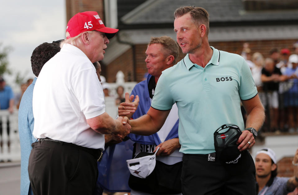 Seen left, Former US President Donald Trump congratulates Henrik Stenson on day three of the LIV Golf Invitational at Trump National Golf Club in New Jersey. 