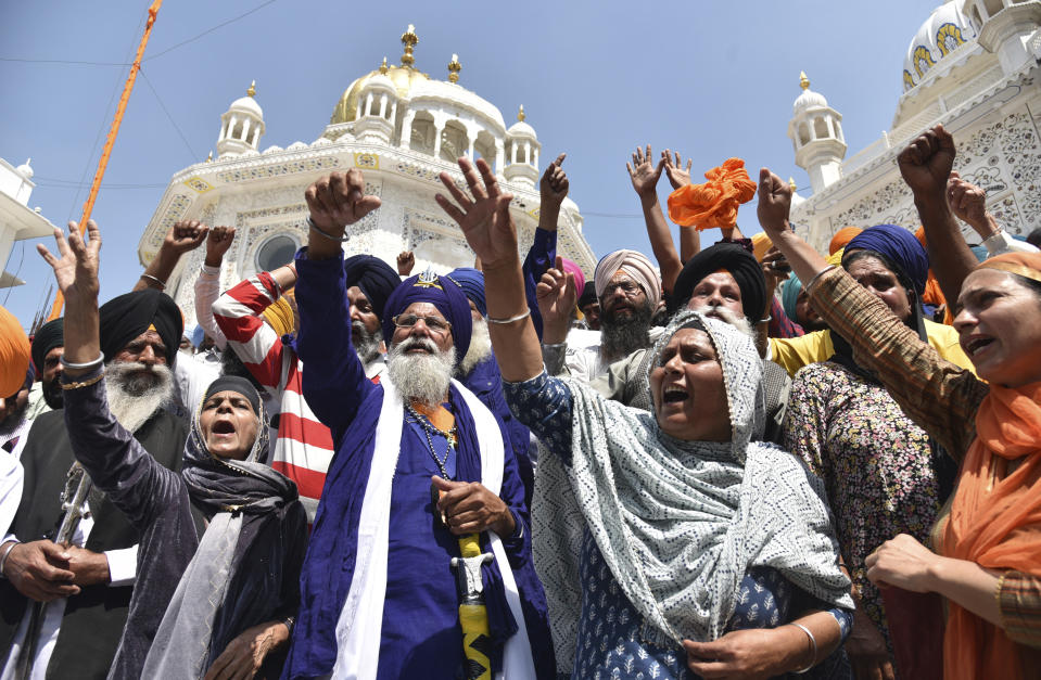 FILE - Supporters of Waris Punjab De organization shout slogans favoring their chief and separatist leader Amritpal Singh and other arrested activists during a meeting at the Akal Takht Secretariat inside Golden Temple complex, in Amritsar, India, on March 27, 2023. Indian police on Sunday, April 23, arrested Amritpal Singh, a Sikh separatist leader who has revived calls for secession of India’s northern Punjab state bordering Pakistan, the police said. (AP Photo/Prabhjot Gill, File)